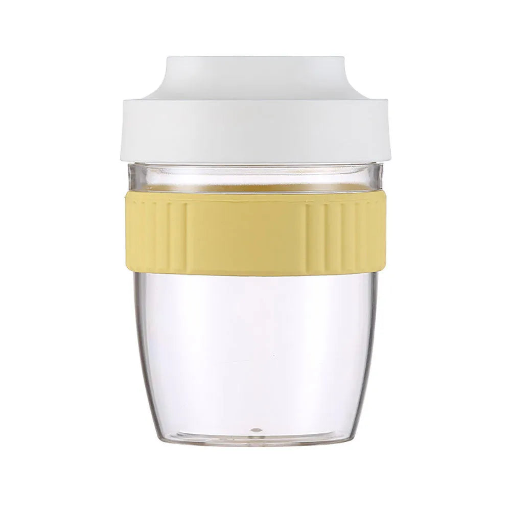 Green plastic salad cup with clear lid and spoon, sealed leak-proof design.