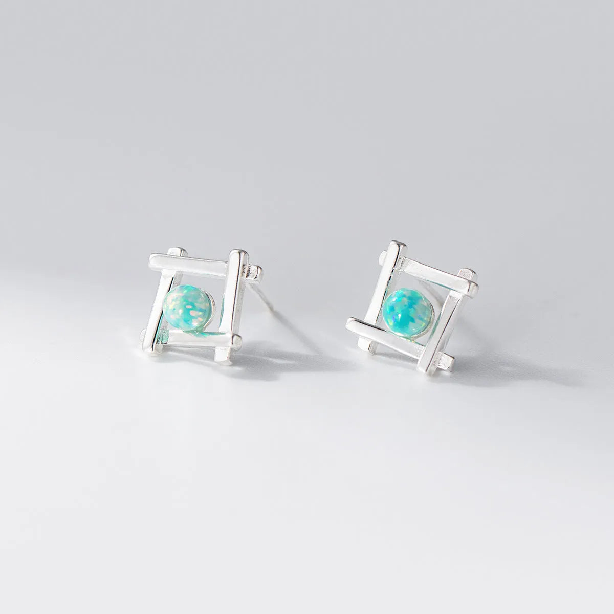 Geometric cross quadrangle stud earrings in 925 silver with two plating options
