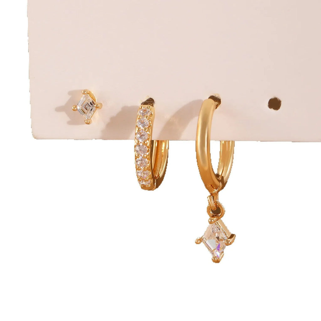 Ladies three-piece earring set with geometric designs and zircon accents in gold or white finish