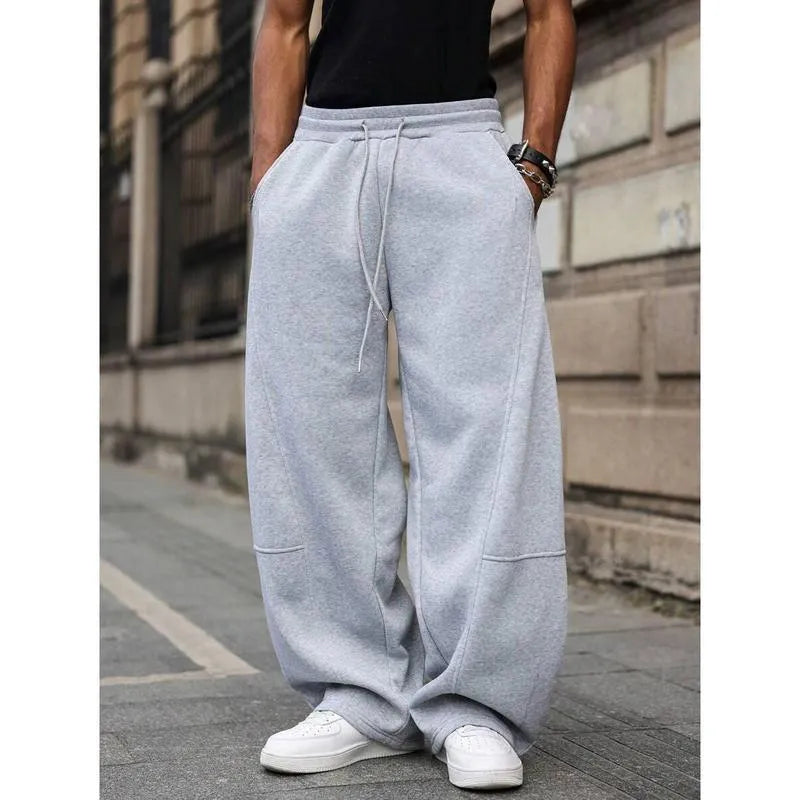 Men's straight leg high waist casual trousers in a grey colour with a cropped length and elasticated waistband.
