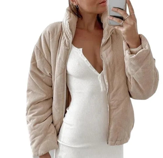 Apricot women's corduroy zip-up jacket with a stand collar, shown on a model.