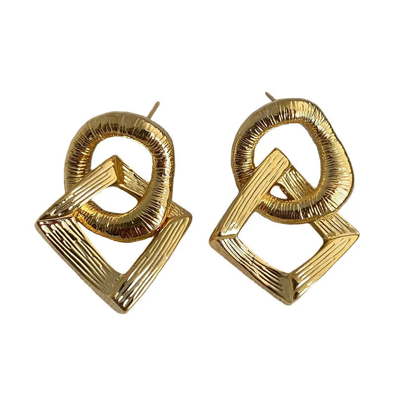 Geometric circle pendant earrings with 3.4cm drop in gold or silver tone electroplated copper