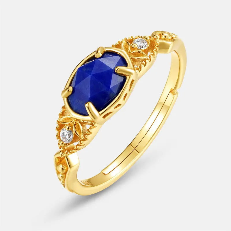 Geometric ellipse lapis lazuli silver ring with Japanese style design on a model's hand.