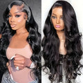 Black synthetic lace wig with big wave hairstyle, shown on a wig stand.
