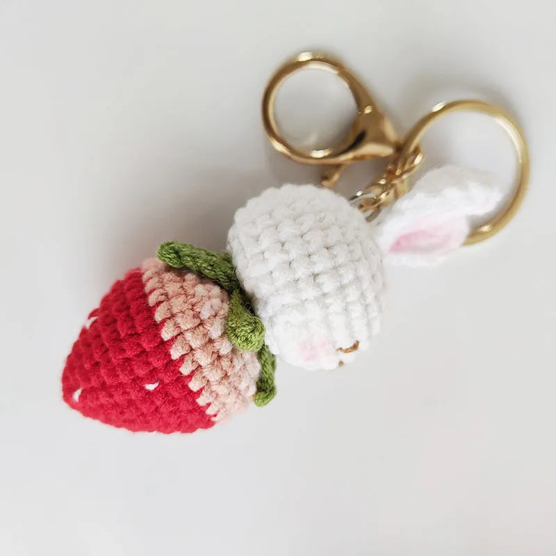Hand-woven white rabbit strawberry pendant with keychain in cartoon style