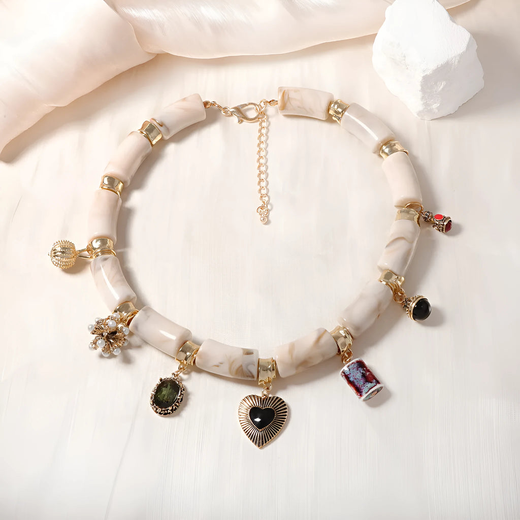 Electroplated heart-shaped resin necklace with bamboo design elements