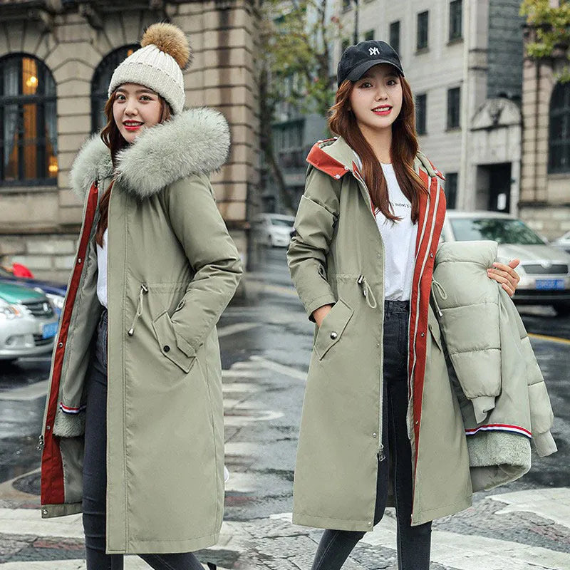 Women's long beige trench coat with fleece lining on a hanger, showing its extended length and elegant style.