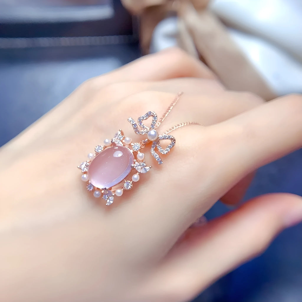 Geometric pink rose quartz pendant on silver necklace with rose gold plating