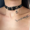 Black leather dog collar with brass bell charm in three designs: LD leather, bone pattern, and cat paw