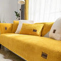 Lambswool sofa cover in solid blue colour on a three-seater sofa