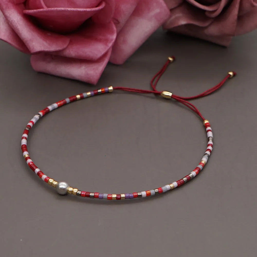 Women's handmade bohemian bracelet with semi-precious stone bead and colourful glass beads.