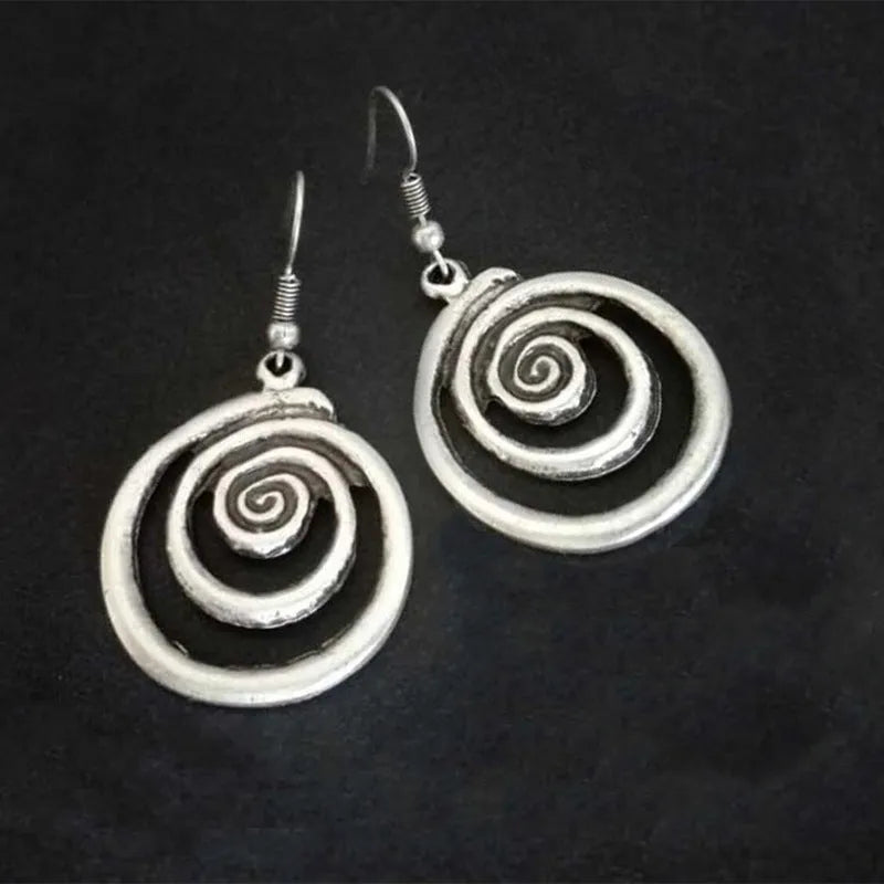 Geometric spiral earrings with distressed silver finish and retro design