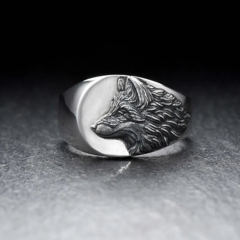 Men's silver geometric wolf ring with retro domineering shape on a hand.