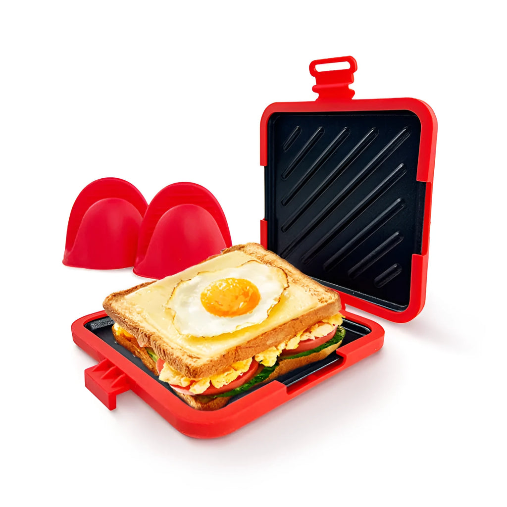 Red silicone baking tray with matching heat-resistant gloves on a kitchen counter.
