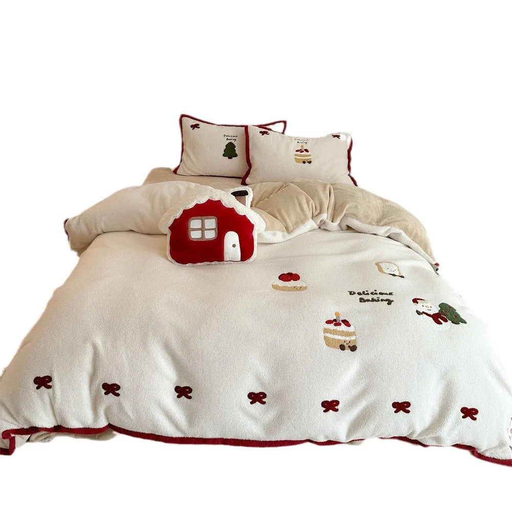 Winter Christmas cartoon print bed linen four-piece set showing fitted sheet, duvet cover, and pillowcases.