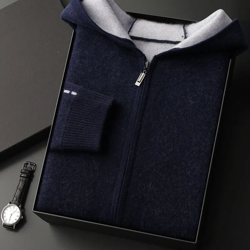 Man wearing a dark blue zip-up cardigan sweater with a half-high collar.