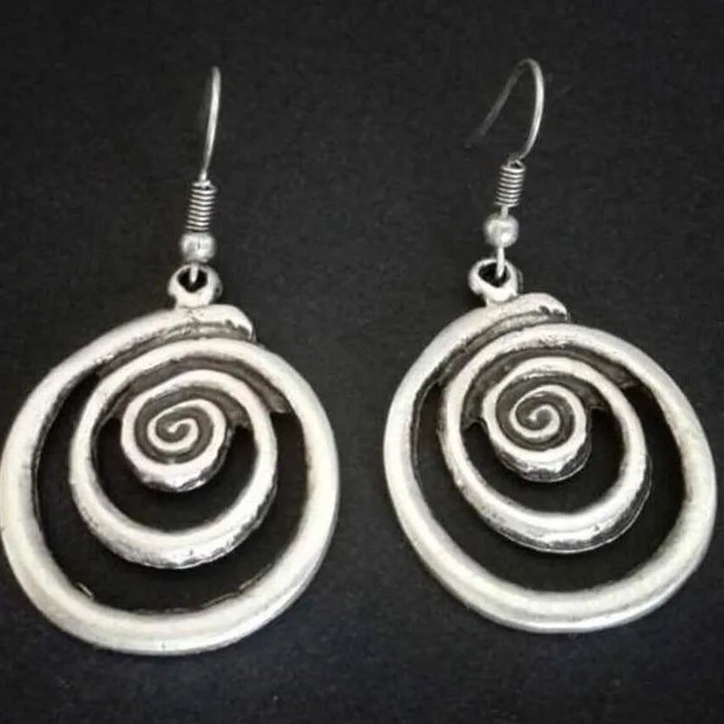 Geometric spiral earrings with distressed silver finish and retro design