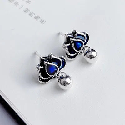 Blue lotus ear studs with lotus seedpod tassel design measuring 1.2cm width