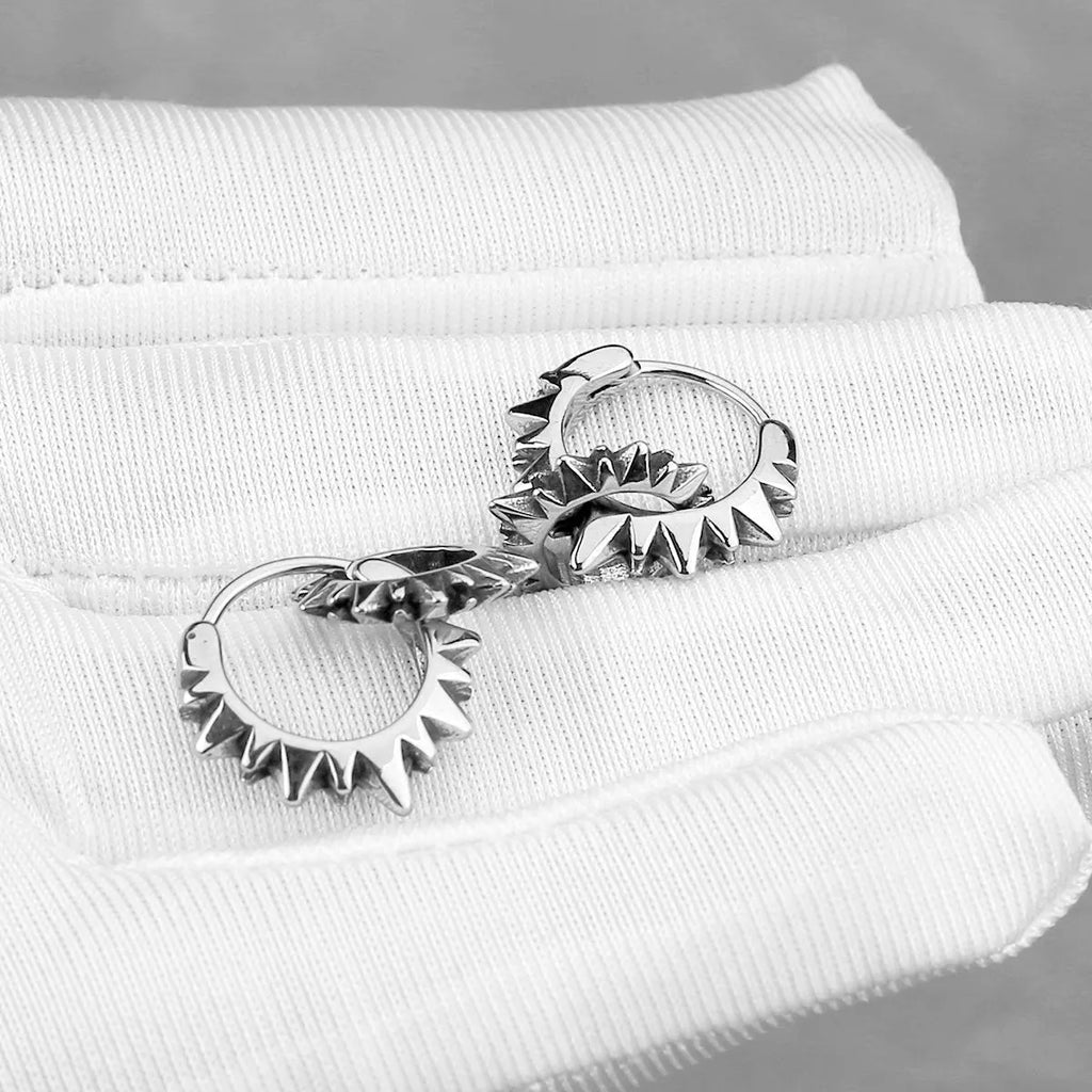 Pair of simple stainless steel round ring earrings with a polished finish and steel colour.