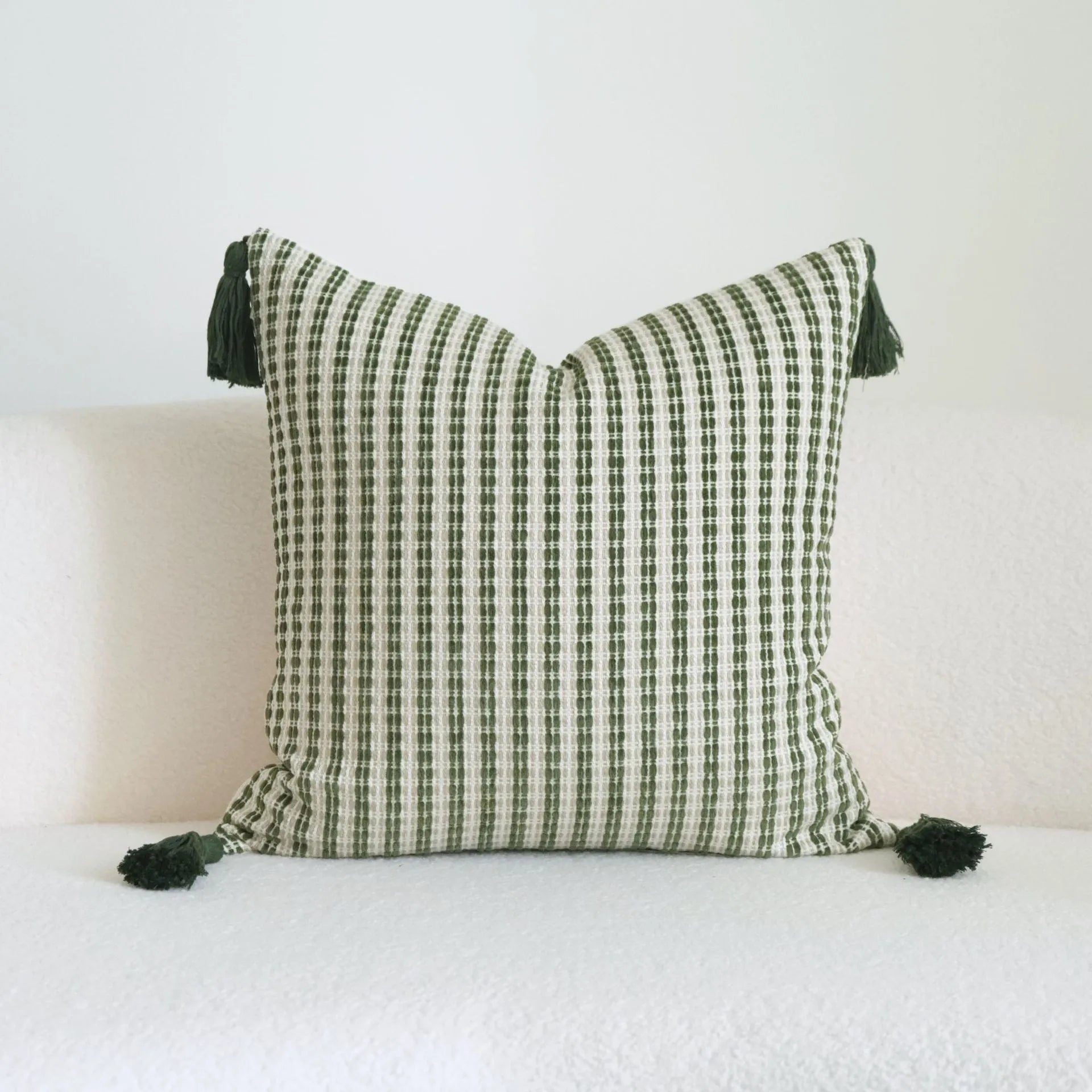Green cotton and linen tassel hotel sample pillow with botanical pattern on brushed fabric pillowcase