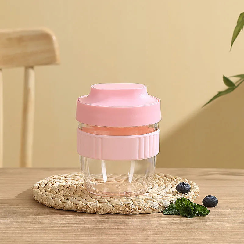 Green plastic salad cup with clear lid and spoon, sealed leak-proof design.