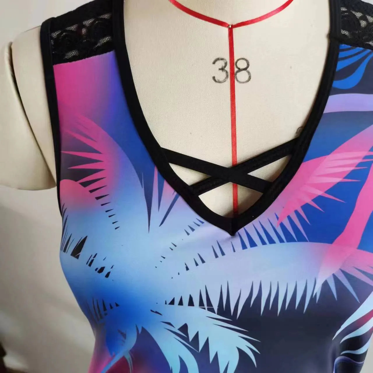 Women's floral printed two-piece swimsuit with sleeveless top and matching shorts in blue or green