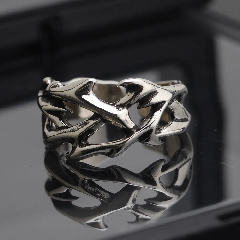 Copper geometric ring with thorn and flower design featuring adjustable opening mechanism