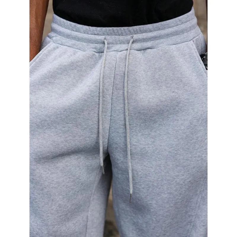 Men's straight leg high waist casual trousers in a grey colour with a cropped length and elasticated waistband.