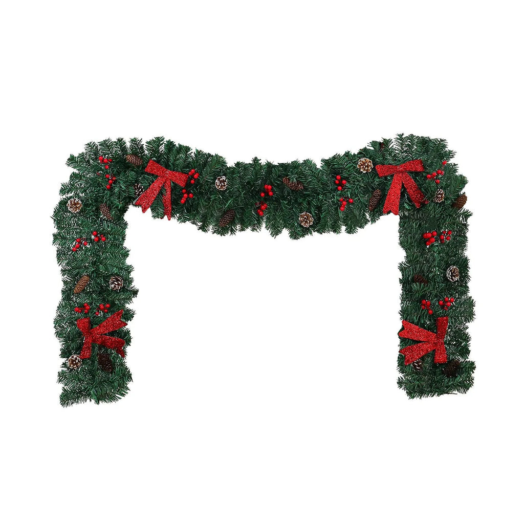 70cm tall Christmas rattan decorative cane with pine cone and red bow, shown on a festive table setting.