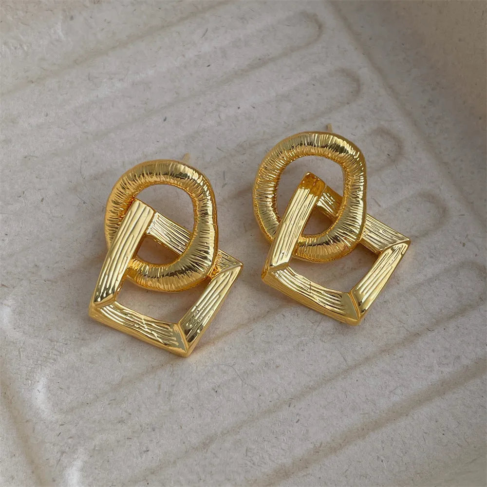 Geometric circle pendant earrings with 3.4cm drop in gold or silver tone electroplated copper
