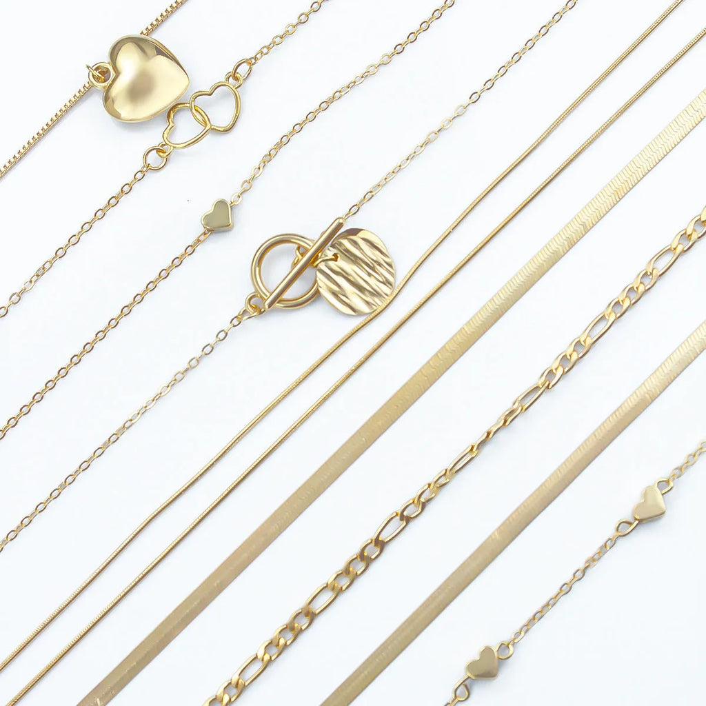 Gold electroplated women's necklace set with 10 pieces featuring snake bone chains and alloy pendants