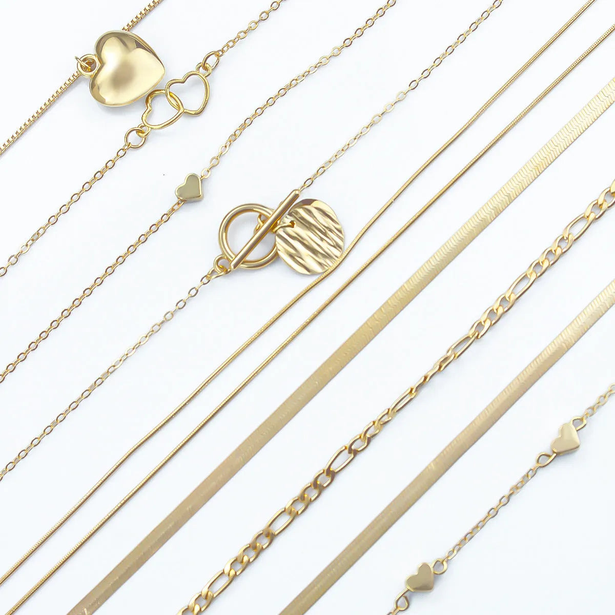 Gold electroplated women's necklace set with 10 pieces featuring snake bone chains and alloy pendants