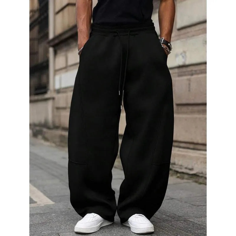 Men's straight leg high waist casual trousers in a grey colour with a cropped length and elasticated waistband.