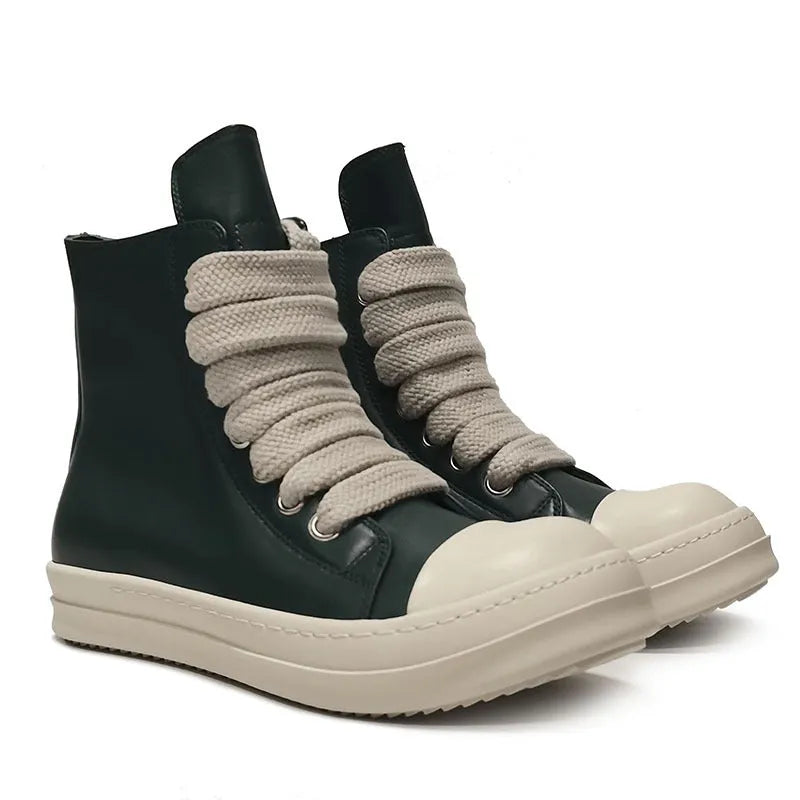 Black high-top leather sneakers with side zipper on a white background.