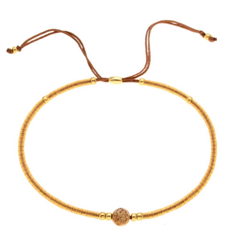 Women's handmade bohemian bracelet with semi-precious stone bead and colourful glass beads.