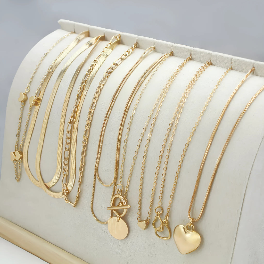 Gold electroplated women's necklace set with 10 pieces featuring snake bone chains and alloy pendants
