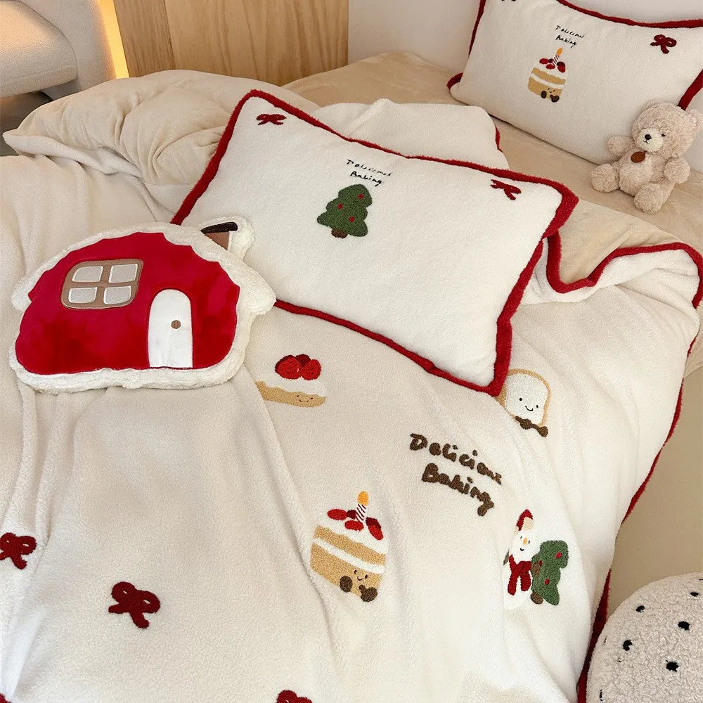 Winter Christmas cartoon print bed linen four-piece set showing fitted sheet, duvet cover, and pillowcases.
