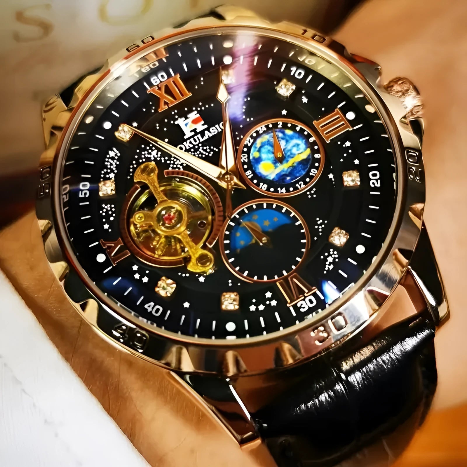 Men's black and rose gold automatic watch with hollow dial and leather strap.