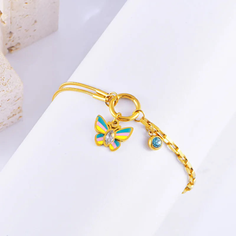 Gold titanium steel butterfly jewellery set with colourful epoxy pendant on snake bones chain necklace and bracelet