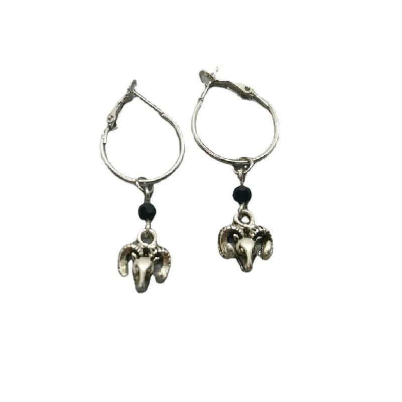 A pair of silver round hoop earrings for women with Tibetan antelope and Western style influences.