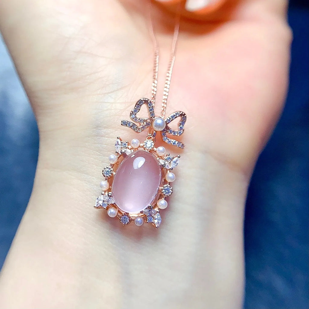 Geometric pink rose quartz pendant on silver necklace with rose gold plating