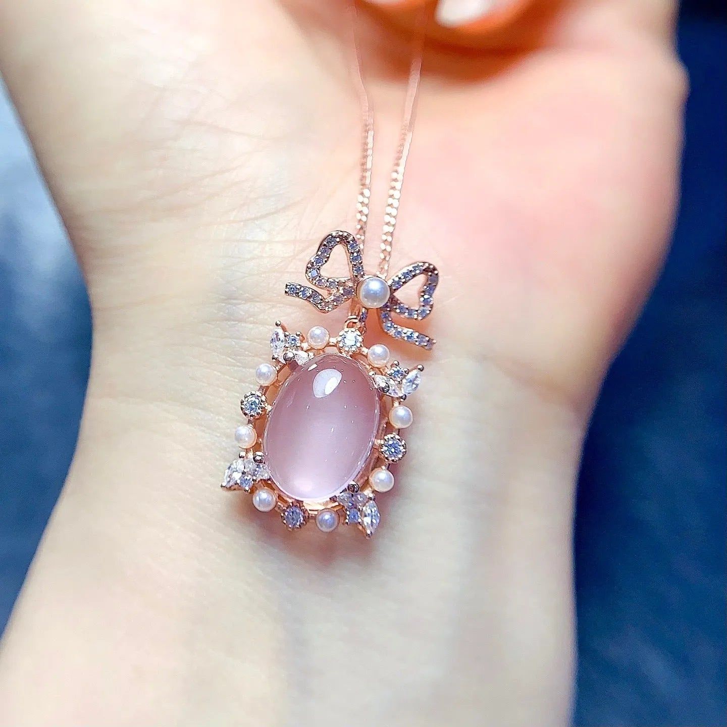 Geometric pink rose quartz pendant on silver necklace with rose gold plating