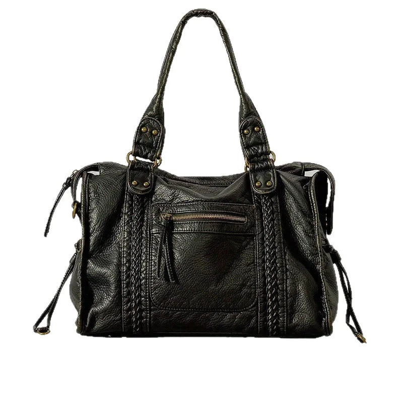 Women's retro motorcycle messenger shoulder bag with woven detail showing organised interior compartments