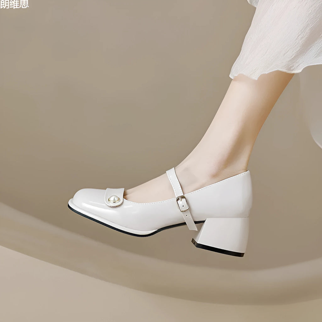 Plus size women's patent leather chunky heel pumps with square toe and buckle fastening in apricot colour.