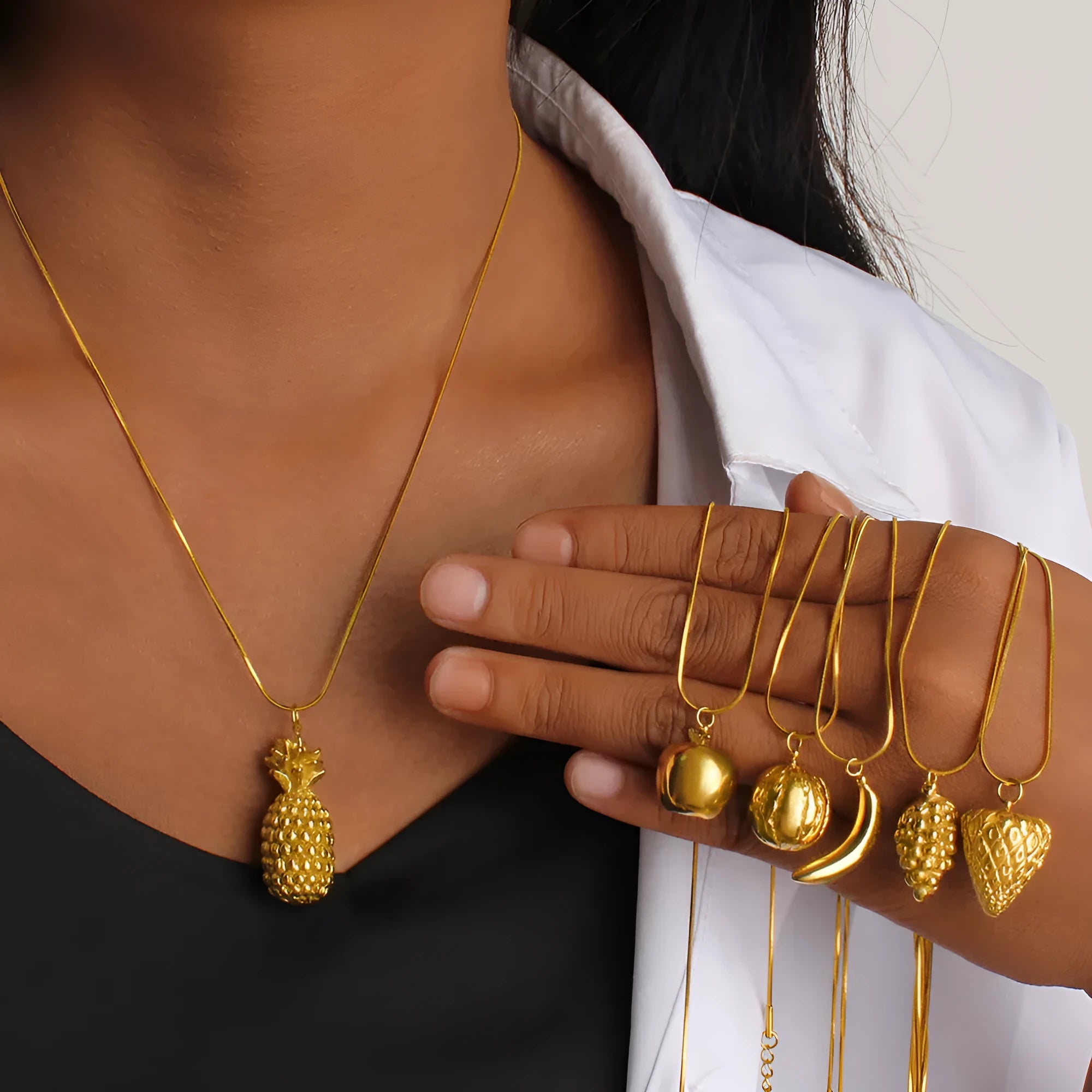 Stainless steel necklace with a detailed alloy fruit pendant charm.