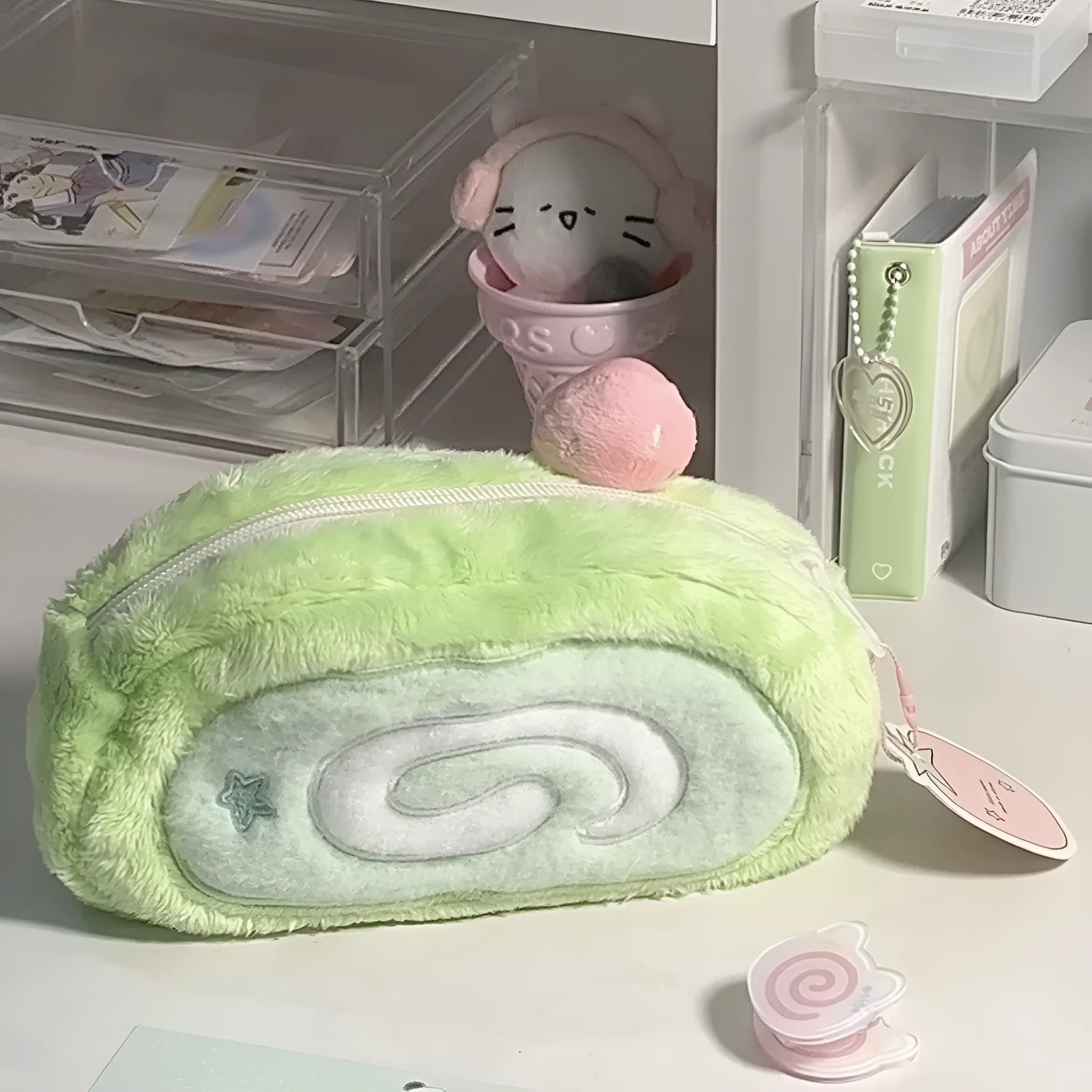 Honeydew Swiss roll cake design velvet pencil case on a flat surface
