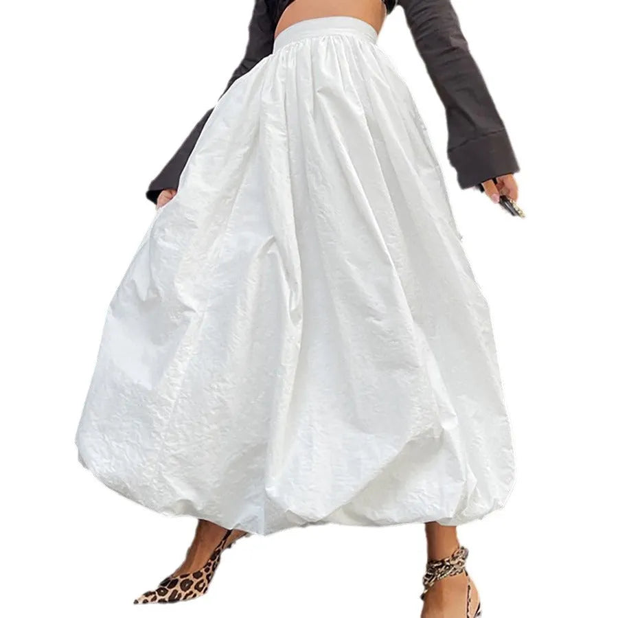 Women's long solid colour cotton skirt on a hanger, showing elasticated waist.