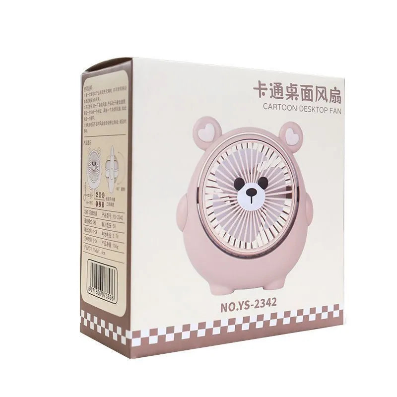USB desktop electric fan in one of six colours including bear brown and puppy designs on a desk.