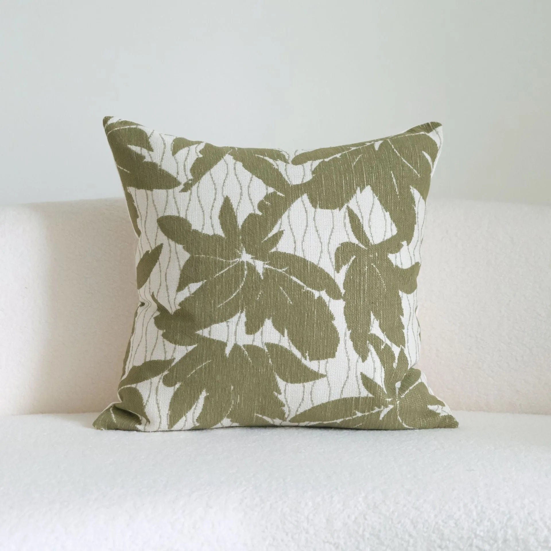 Green cotton and linen tassel hotel sample pillow with botanical pattern on brushed fabric pillowcase