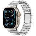 Silver stainless steel magnetic buckle strap for an Apple Watch on a wrist